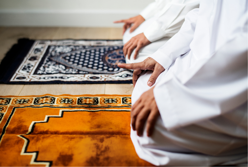 Two Muslim men praying in mosque